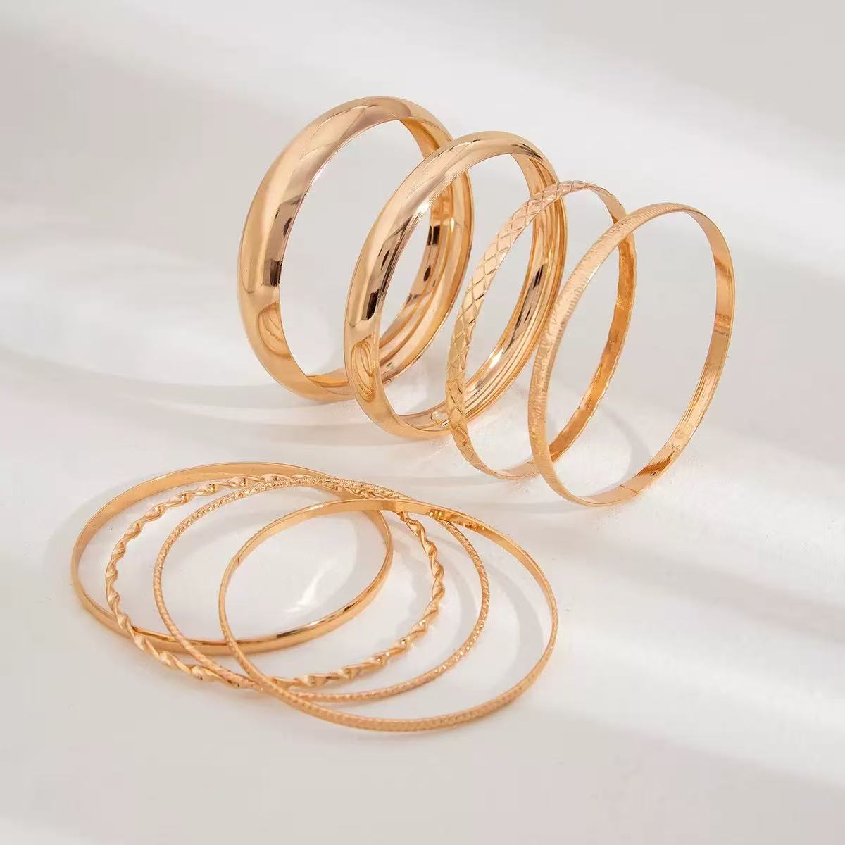 Golden Bangle Set – 8-Piece Textured Elegance